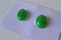 Pair of Chinese green unset jade gems,