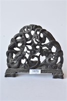 Black stone carving of 2 dragons contesting
