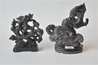 2 x carved black stone dragon sculptures,