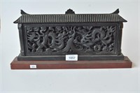 Carved black stone panel of 2 dragons
