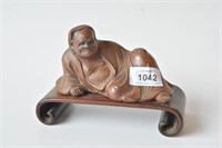 Yixing figure of a monk resting on a