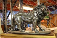 Self painted resin sculpture of a lion,