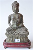 Bronze figure of Buddha holding a miniature pagoda