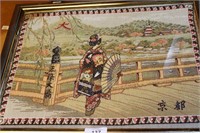 Japanese motif tapestry, framed behind glass and