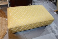 French ottoman, upholstered in a