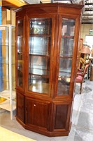 Oriental style teak display cabinet featuring