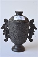 Black stone covered urn