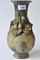 Rust stone vase carved with a large dragon among