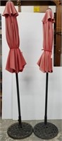 Two cast iron base patio umbrellas