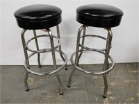 Pair of chrome and black vinyl bar stools