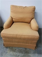 Peach colored chair and ottoman