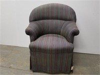 Upholstered club chair on casters