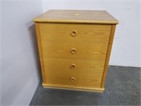 Four drawer light colored cabinet