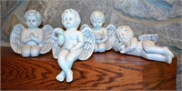 4 Porcelain shelf cherubs/angels, off white base