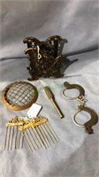 Cast iron paper holder, brass flower frog, toy