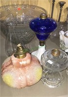 Three nice antique oil lamp bases, one chimney