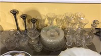 Large group of etched glassware including plates