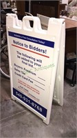 Molded plastics sandwich board with the auction