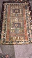 Antique hand woven tribal rug, 67 x 39, has wear,