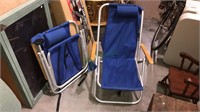 Pair of folding beach chairs with the cupholder