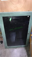 Glass top display case with a lock that includes