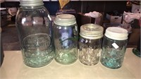 Four different brands of fruit jars with the
