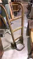 Antique steel wheel dolly, 42 inches tall, made