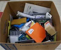 Box of assorted phone cases screen protectors for