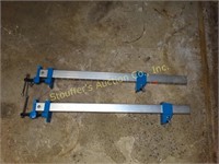 2 Aluminum w/ blue cast metal clamps - 20"