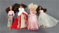 4 barbies Holiday no boxes