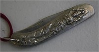 Folding pocket knife with decorative Buddha handle