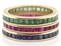 Three 18ct gold emerald, ruby and sapphire rings