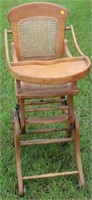 ADJUSTABLE OAK CHILDS HIGH CHAIR W/CANE BACK AND