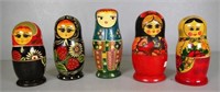 Five wooden Russian doll sets
