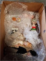 Box of porc. Dolls