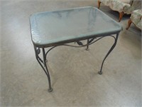 Metal patio side table with glass top