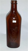 Vintage "fisherman embossed" brown bottle 9 1/4"