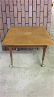 Vintage wooden table on wheels