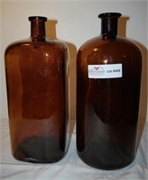 2 unmatched amber apothecary bottle