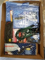 Box lot with 2 tarps, various bungee cords and a B