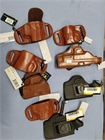 Lot of 8 new leather holsters by Tagua      (k 1)