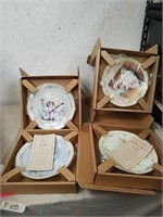 4 collectible plates in original boxes with COA