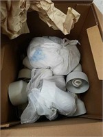 Box full of light fixtures with bulbs