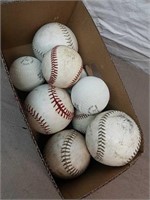 Group of baseballs and softballs