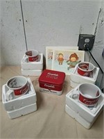 Group of collectible Campbell's soup mugs tin can