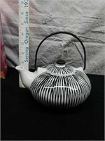 Decorative black and white ceramic teapot