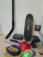 Small skateboard, with hockey stick and outdoor