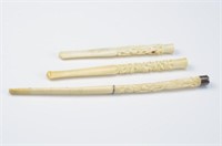 THREE ANTIQUE CHINESE IVORY CIGARETTE HOLDERS