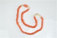 A MULTI STRAND CORAL & FRESHWATER PEARL NECKLACE