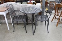Cast aluminum table and 2 chairs.  Table 25"